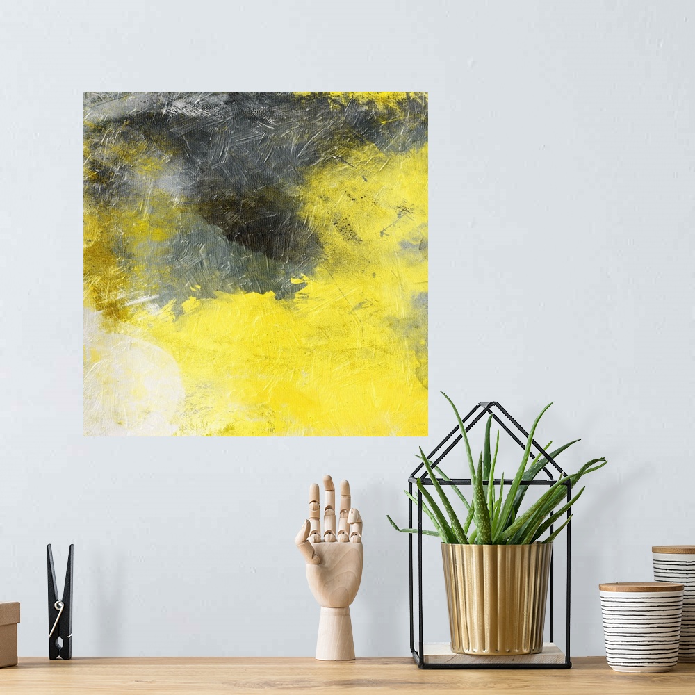 A bohemian room featuring Bright yellow and dark gray merging together in this abstract painting.