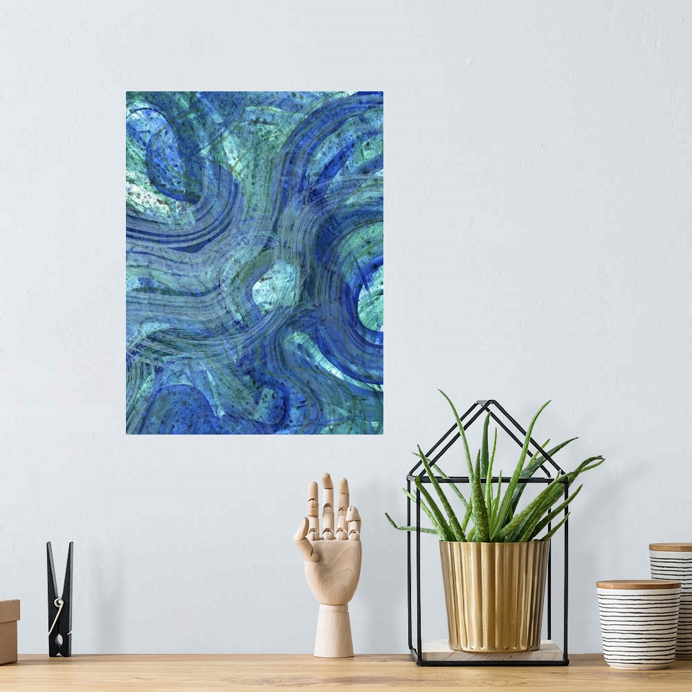 A bohemian room featuring Contemporary abstract artwork resembling waves in deep blue water.