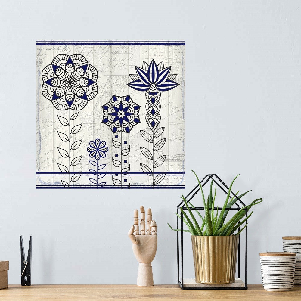 A bohemian room featuring A black and blue symmetric design of four flowers with a collage of handwritten postcards in the ...