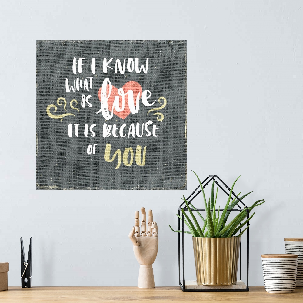 A bohemian room featuring "If I know what is love is it is because of you" written on burlap.