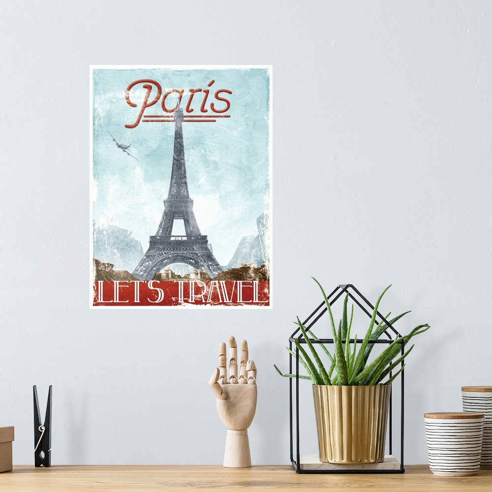 A bohemian room featuring Home decor artwork of a travel poster for France in a vintage style.