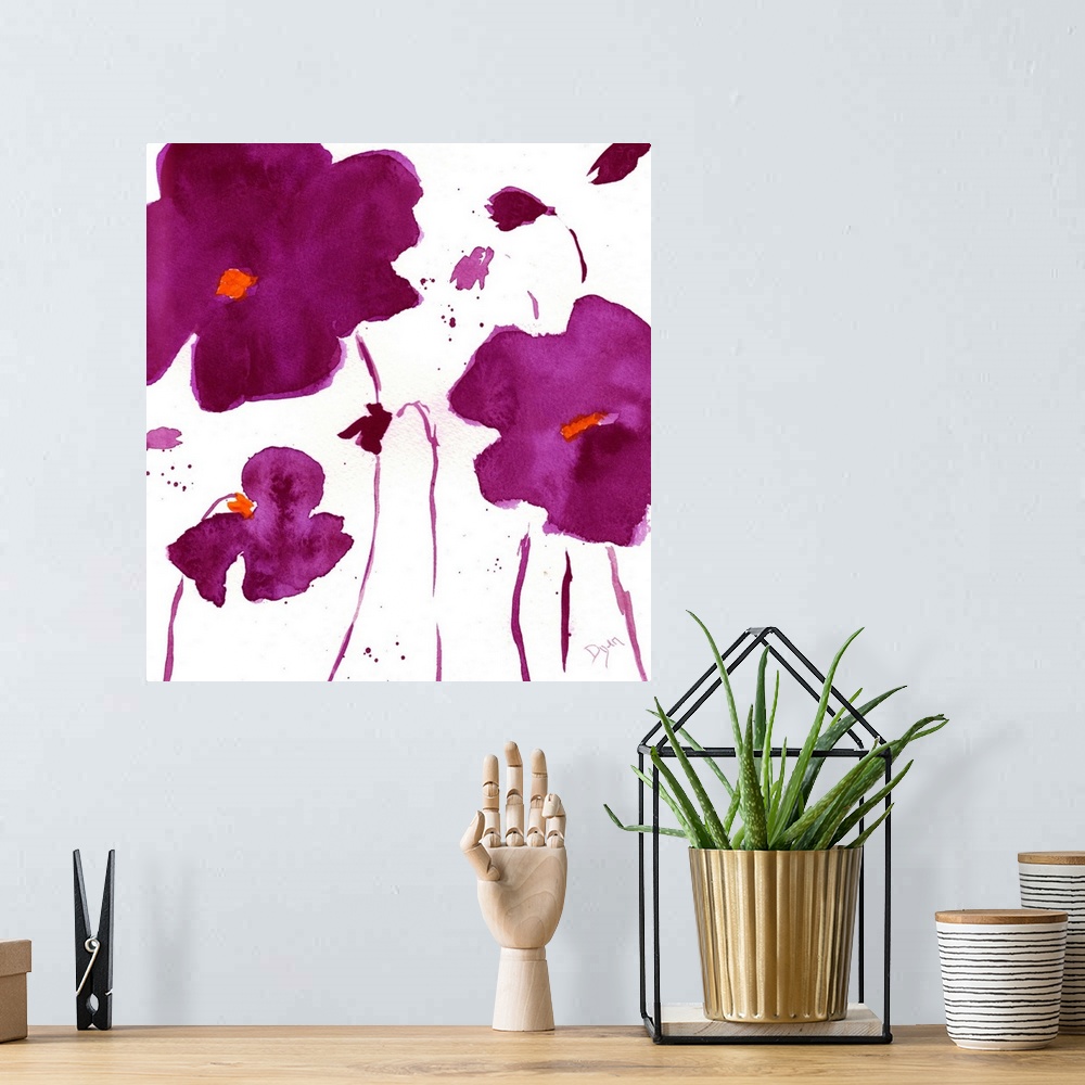 A bohemian room featuring Watercolor painting of dark purple flowers on a white surface.