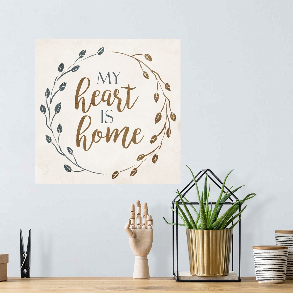 A bohemian room featuring "My Heart is Home" with a wreath of leaves on a cream background.