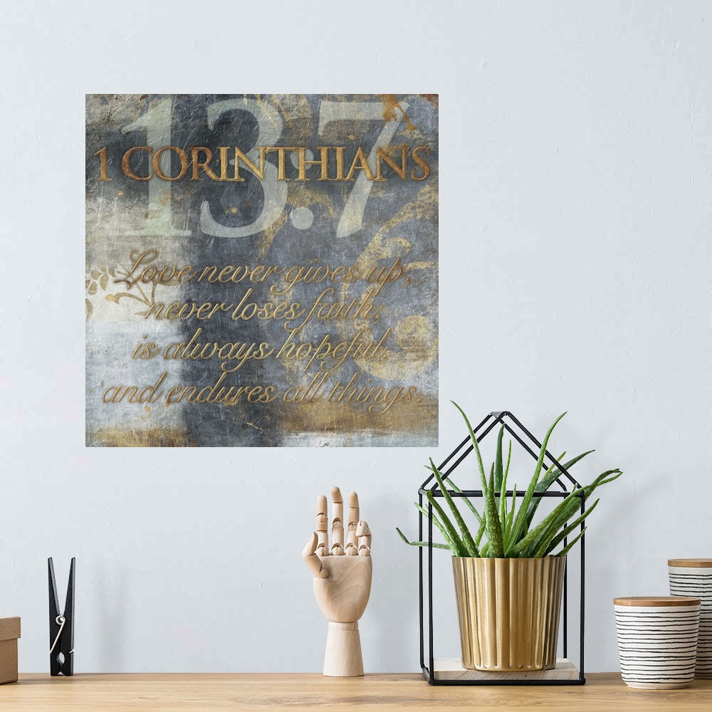 A bohemian room featuring Typography art of the Bible verse 1 Corinthians 13:7.