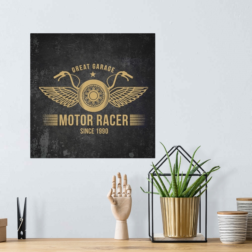 A bohemian room featuring Gold and black garage sign with a motorcycle and wings design.
