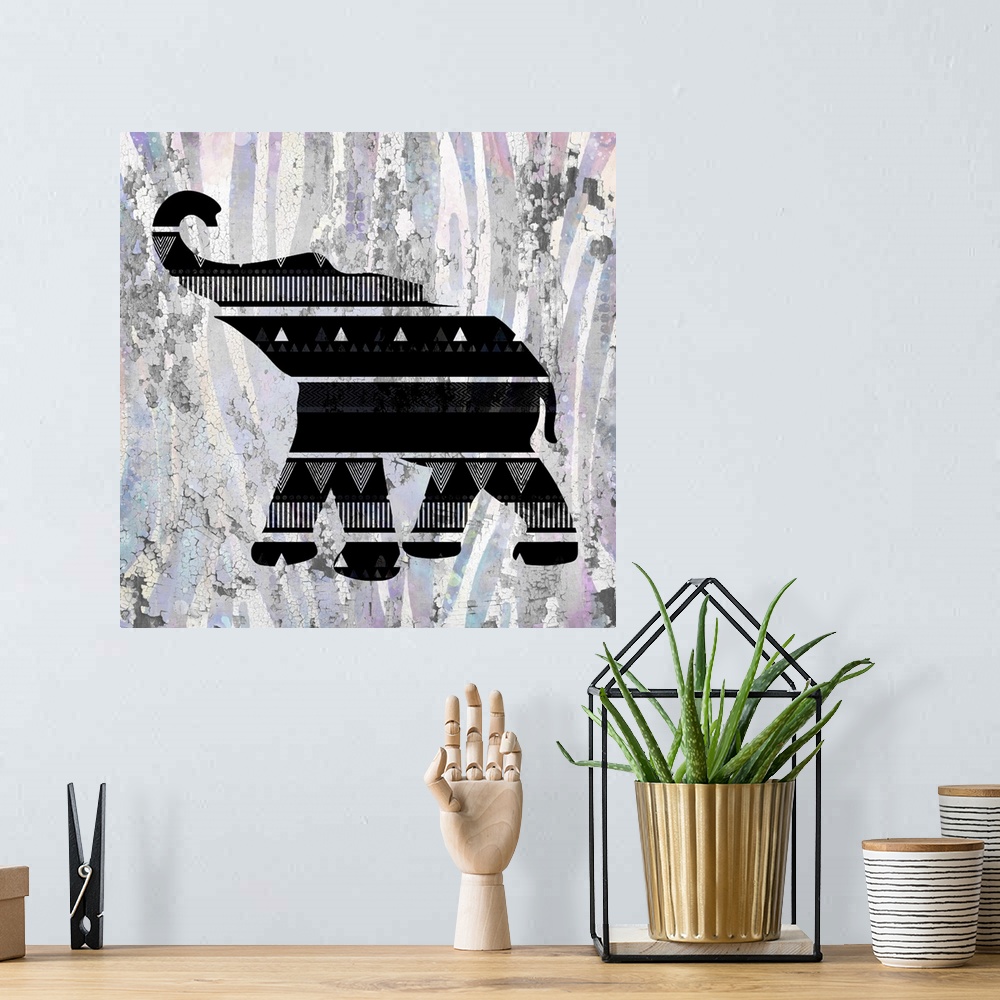 A bohemian room featuring A black designed silhouette of an elephant on a colorful textured background.