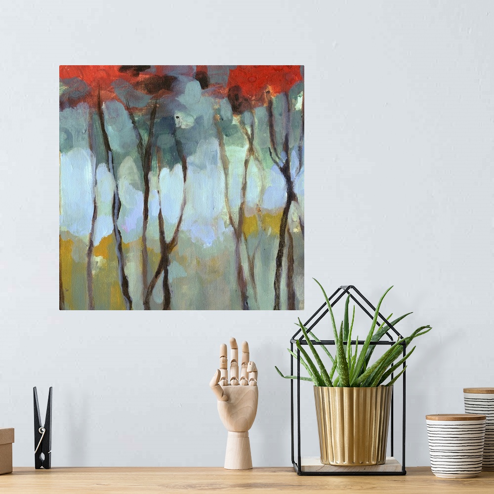 A bohemian room featuring Contemporary artwork of thin birch trees in a dark forest with bright leaves.