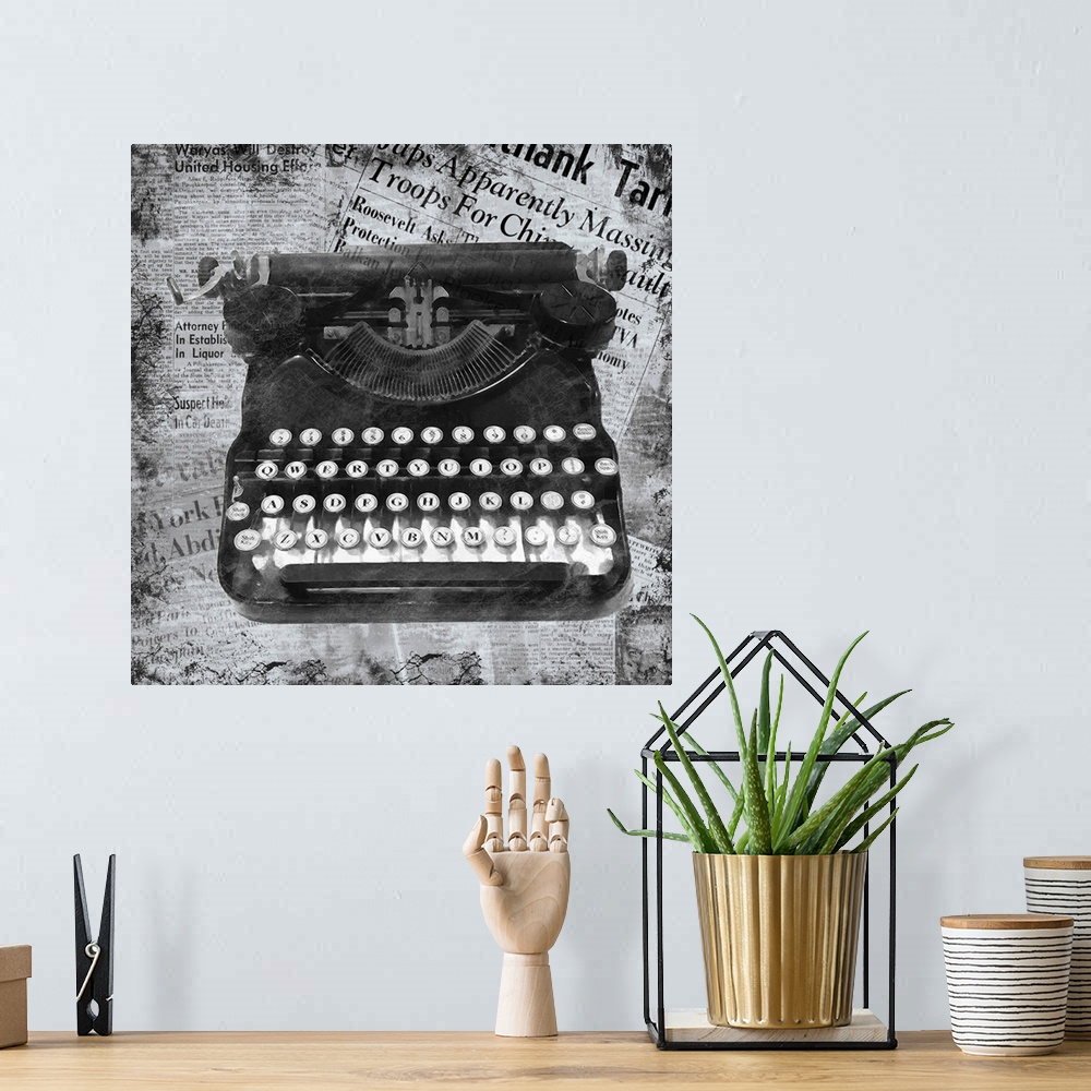 A bohemian room featuring A black and white image of a vintage typewriter on a newspaper clipping background.