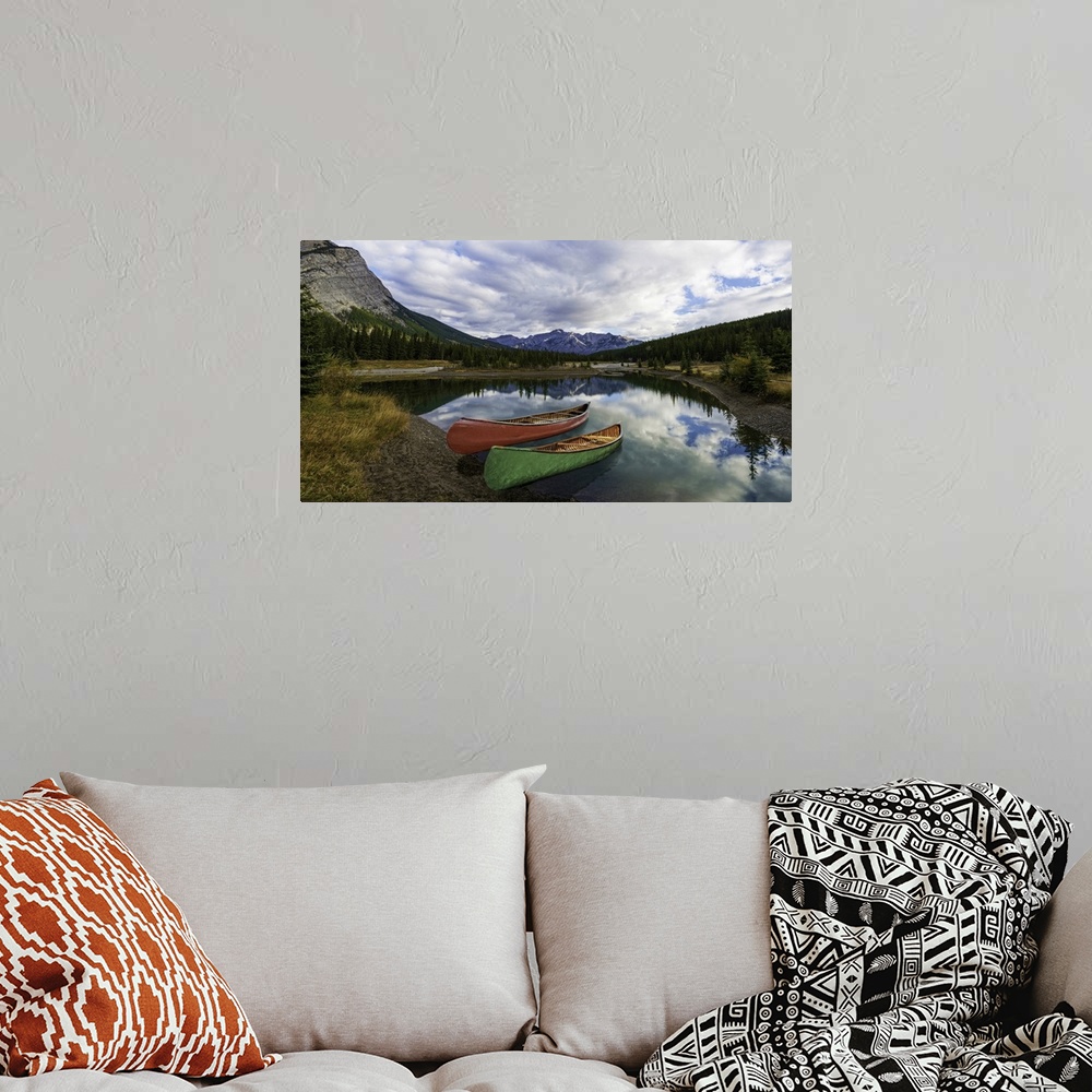 A bohemian room featuring Canoe reflection at Cascade Ponds, Banff, Canada