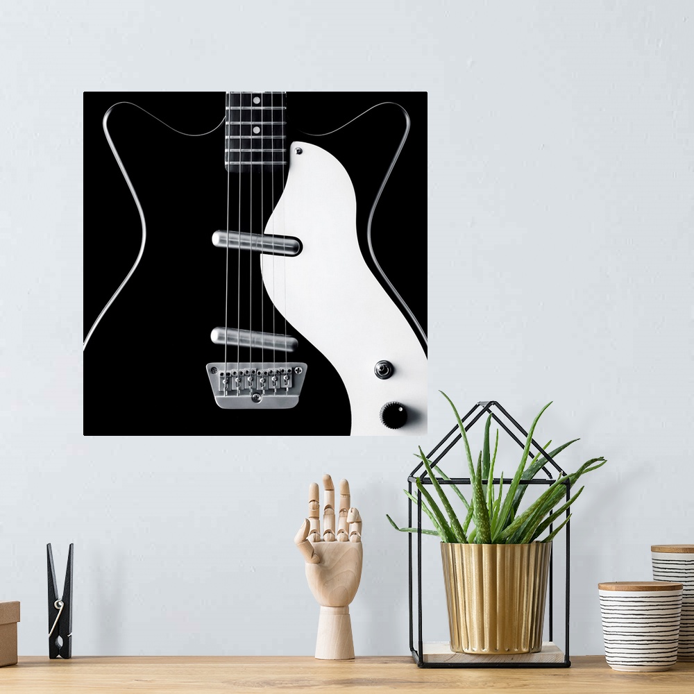 A bohemian room featuring Close-up of a black and white electric guitar.