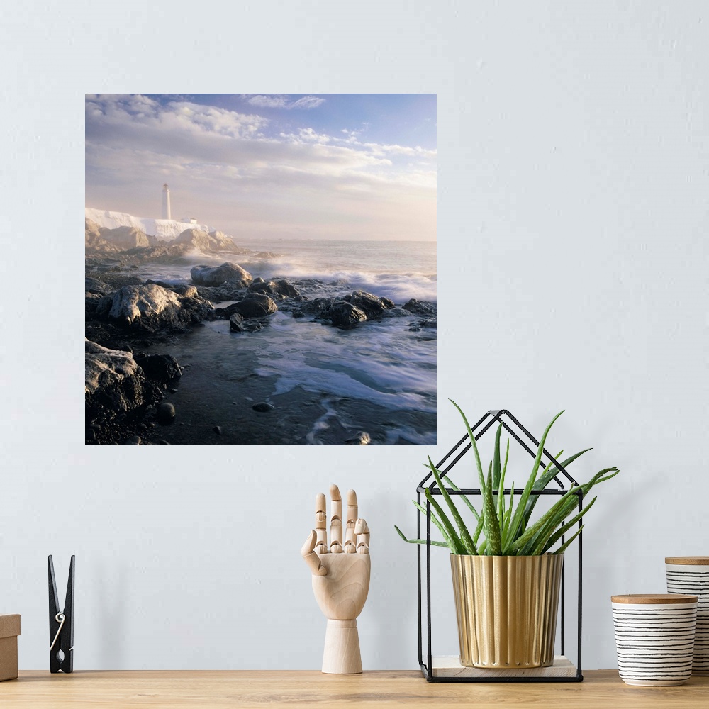 A bohemian room featuring Fog And Rocky Shoreline In Winter With Cap Des Rosiers Lighthouse, Quebec, Canada