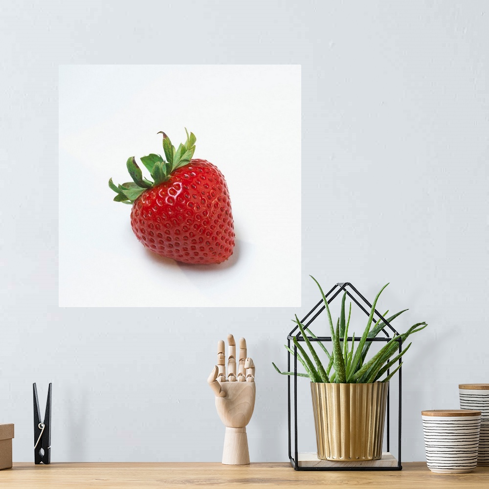 A bohemian room featuring Fresh Ripe Strawberry Against White Background