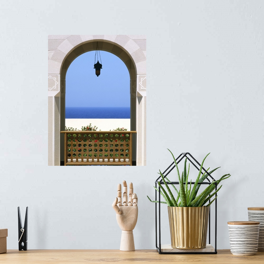 A bohemian room featuring View Through Archway To Beach And Sea
