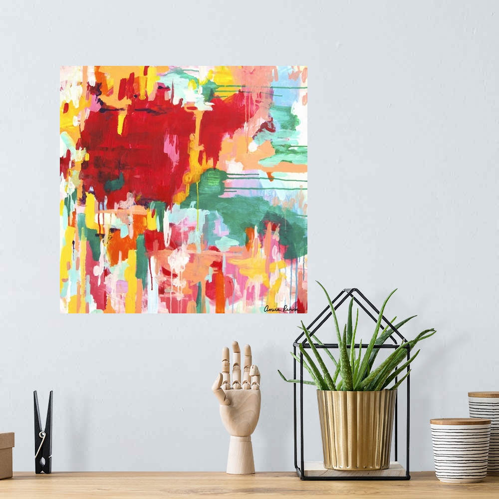 A bohemian room featuring Contemporary abstract artwork in red, yellow, and green tones.