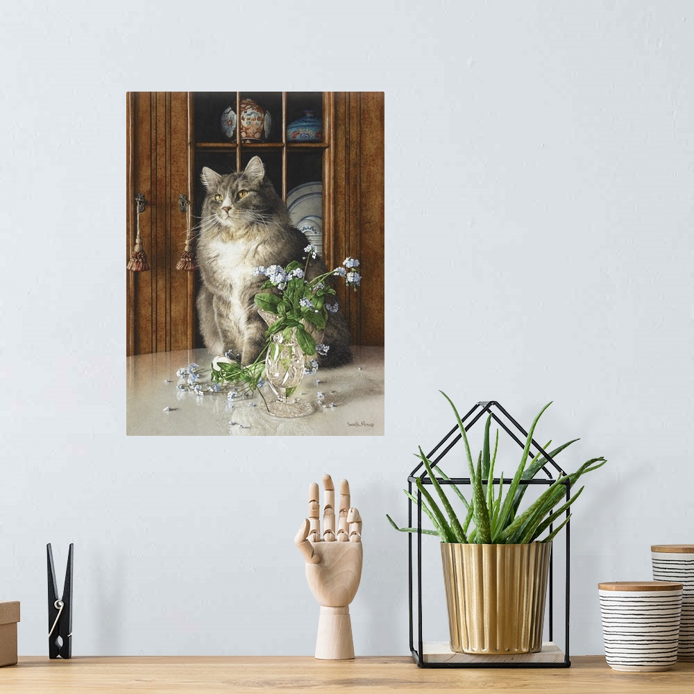A bohemian room featuring Vertical image of a white and gray cat sitting on a table next to a glass vase of blue flowers.