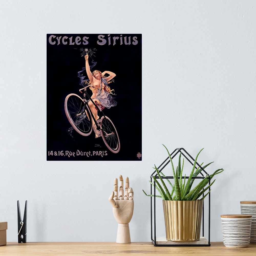 A bohemian room featuring Vintage poster of a woman on a bicycle reaching up to touch a star with text written above and be...