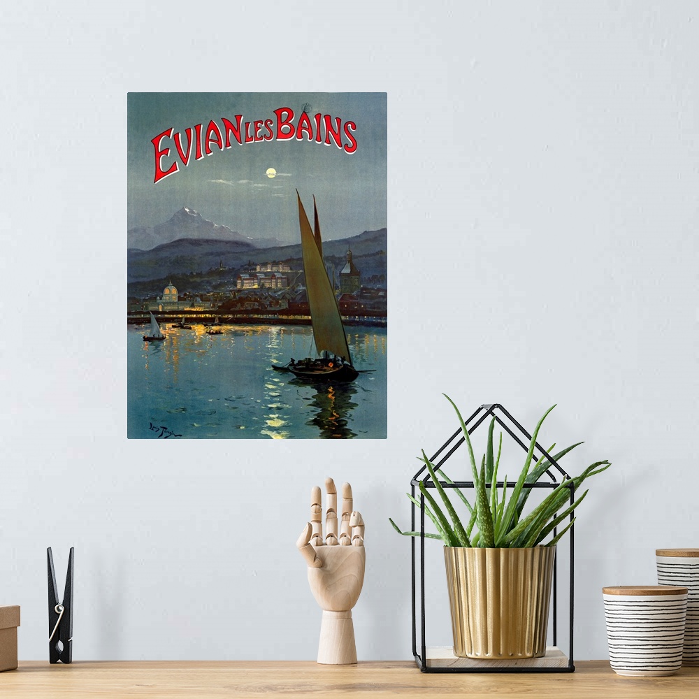A bohemian room featuring Big, vertical vintage travel advertisement for Evian les Bains of several sailboats in the moonli...