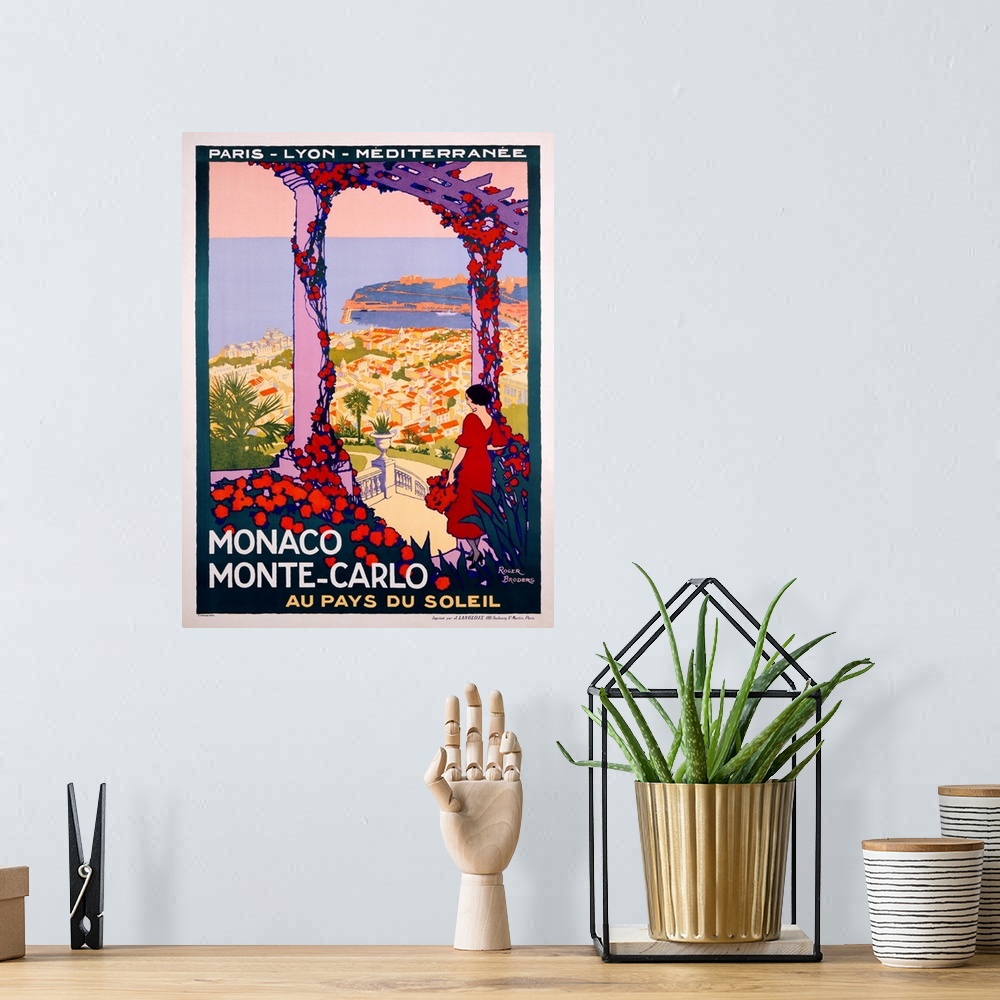 A bohemian room featuring Vintage Art Deco travel poster advertising travel and tourism to Monaco and Monte Carlo.