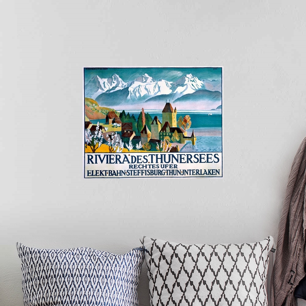 A bohemian room featuring Vintage poster of a small town that sits on the water. Snow topped mountains are drawn in the bac...