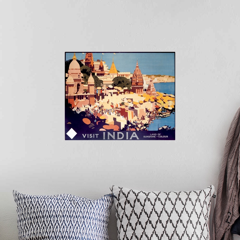 A bohemian room featuring Travel advertisement for India, the Land of Sunshine and Color, featuring the city of Varanasi.