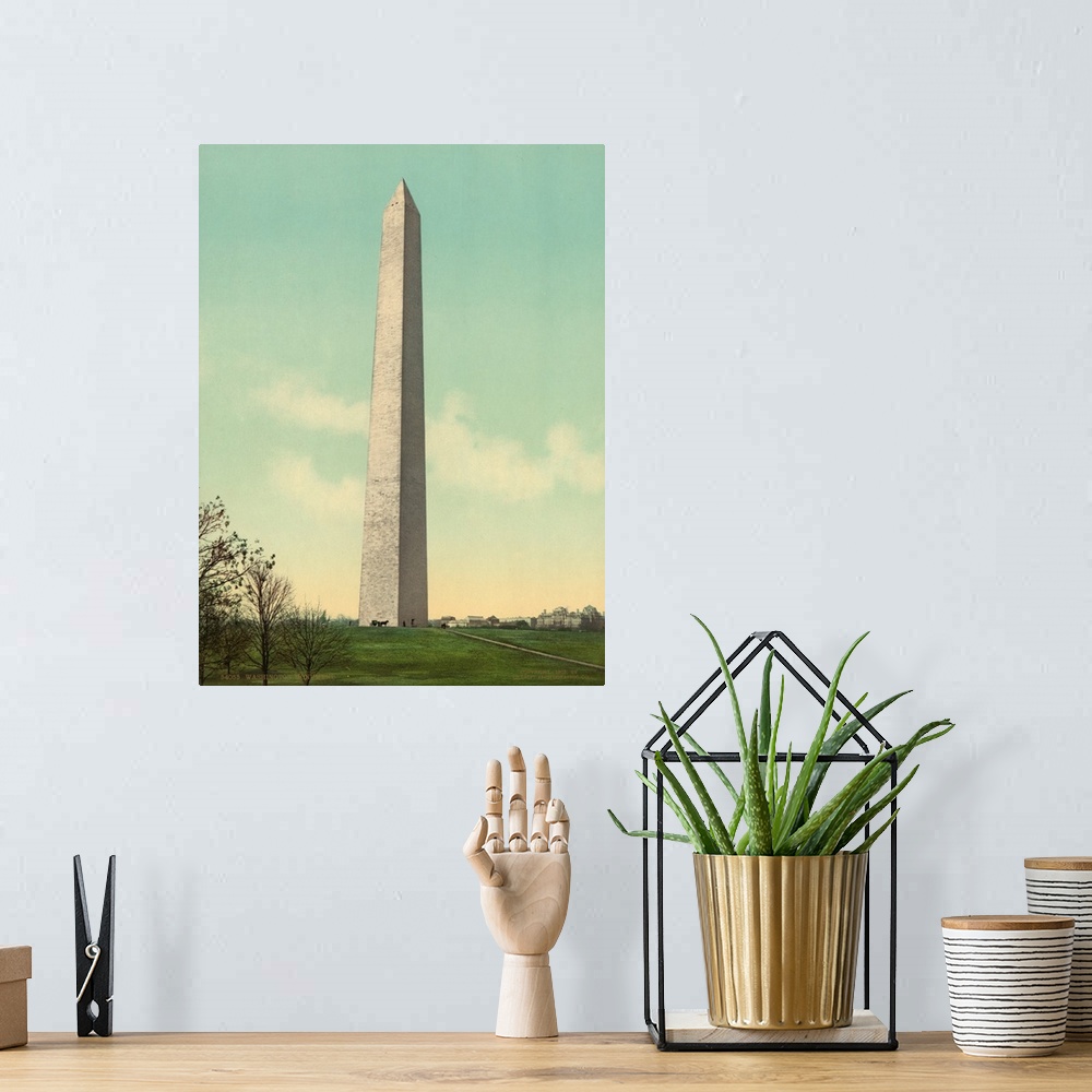 A bohemian room featuring Hand colored photograph of Washington monument.