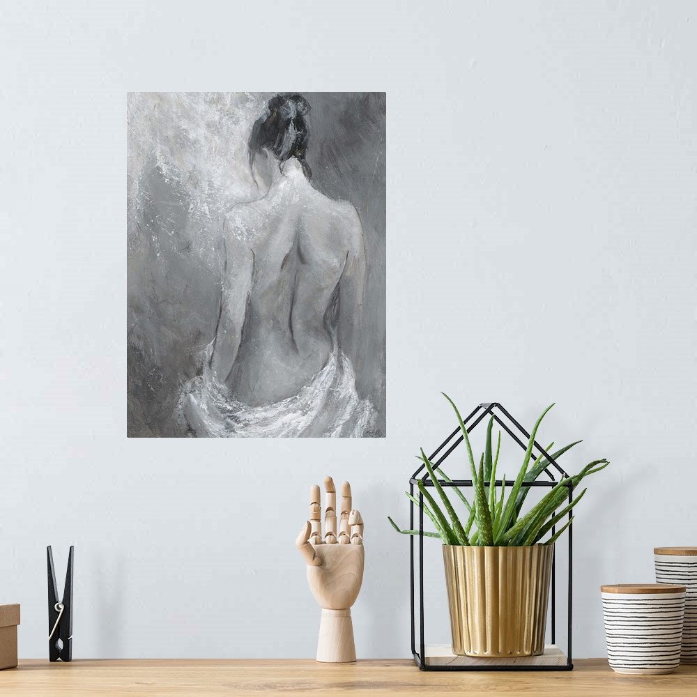 A bohemian room featuring Monochrome artwork of a nude female figure.