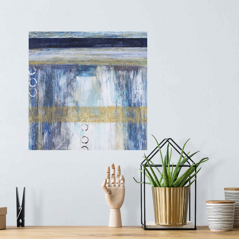 A bohemian room featuring Contemporary abstract painting using blue and neutral tones with hints of gold.