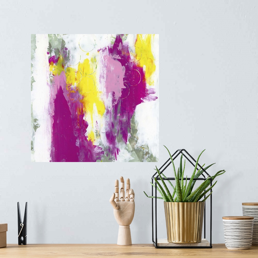 A bohemian room featuring A contemporary abstract painting using splashes of bright pink and purple tones against a predomi...