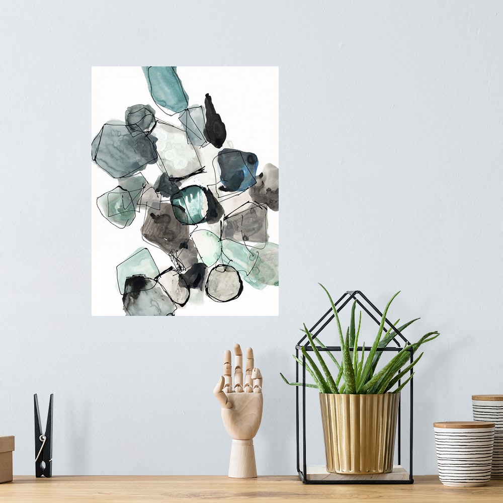 A bohemian room featuring Abstract artwork in grey and turquoise shapes resembling a collection of gemstones.