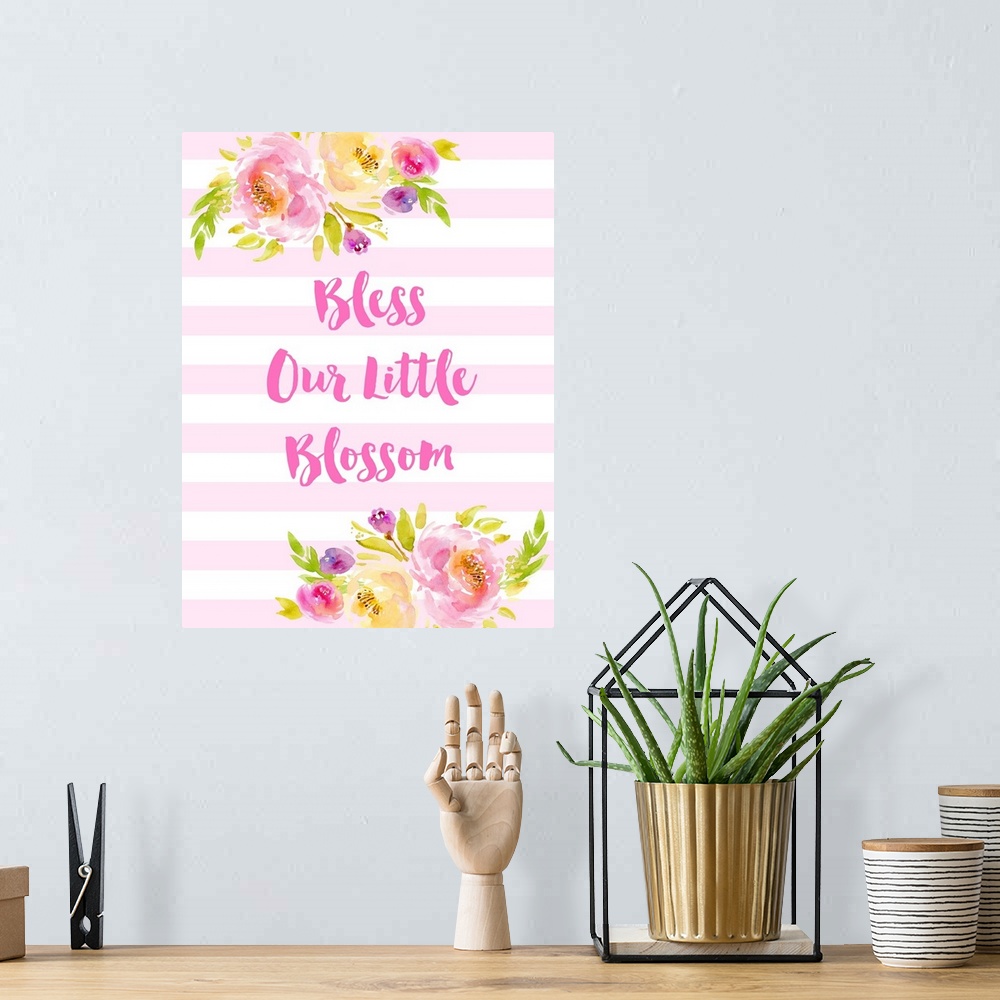 A bohemian room featuring "God Bless Our Little Blossom" in pink and white with illustrated flowers.
