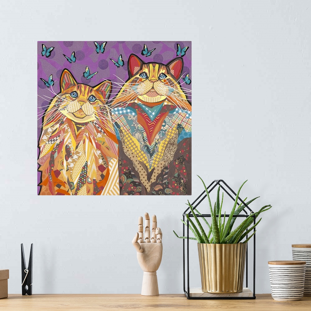 A bohemian room featuring Colorful collage artwork of two cats with long whiskers.