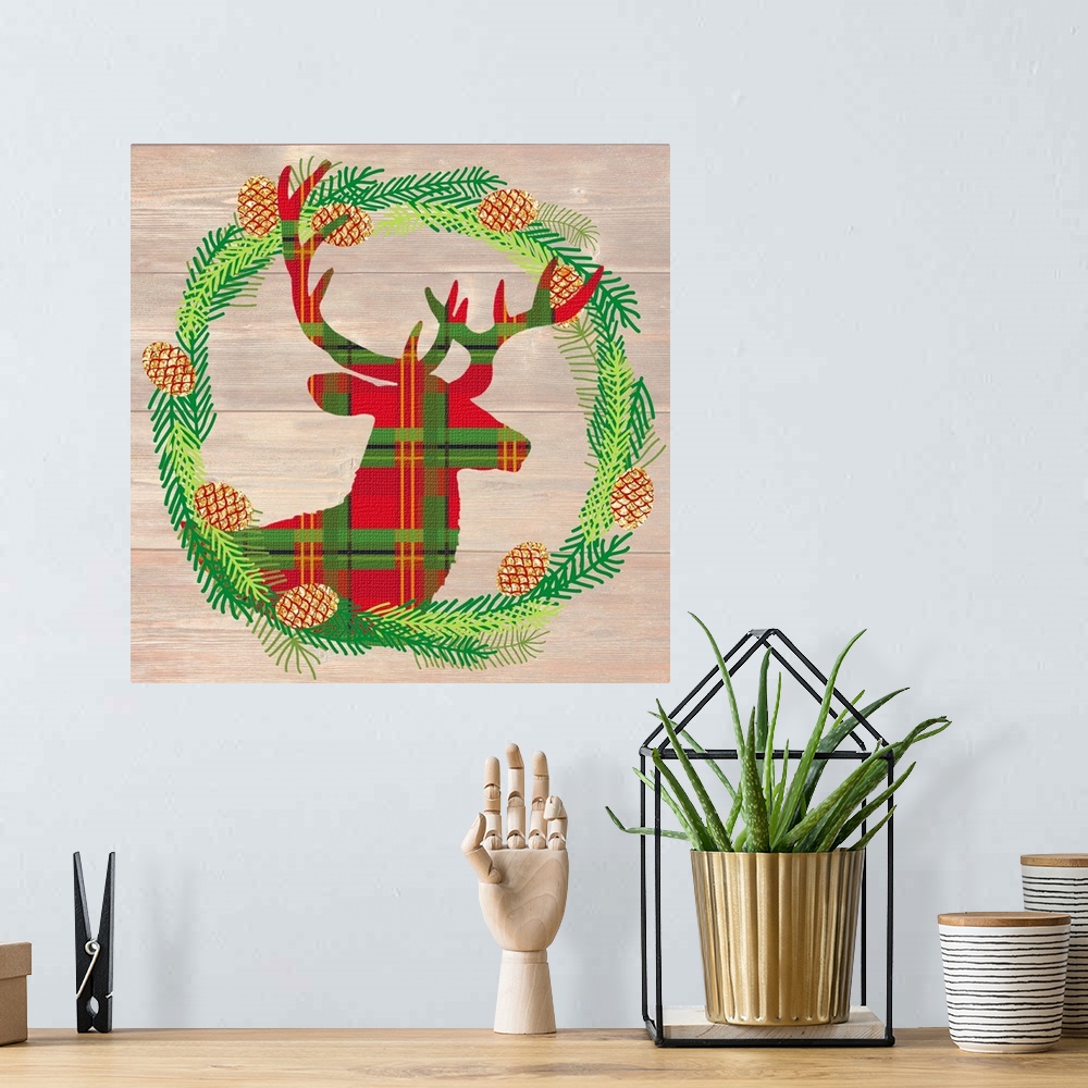 A bohemian room featuring Plaid silhouette of a deer inside of a Winter wreath in blue, green, and gold hues on a faux wood...