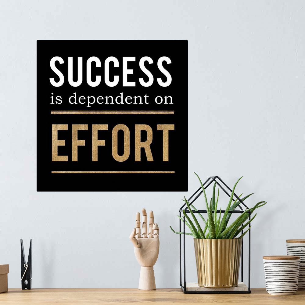 A bohemian room featuring Square office decor with "Success is dependent on Effort" written in white and gold on a black ba...