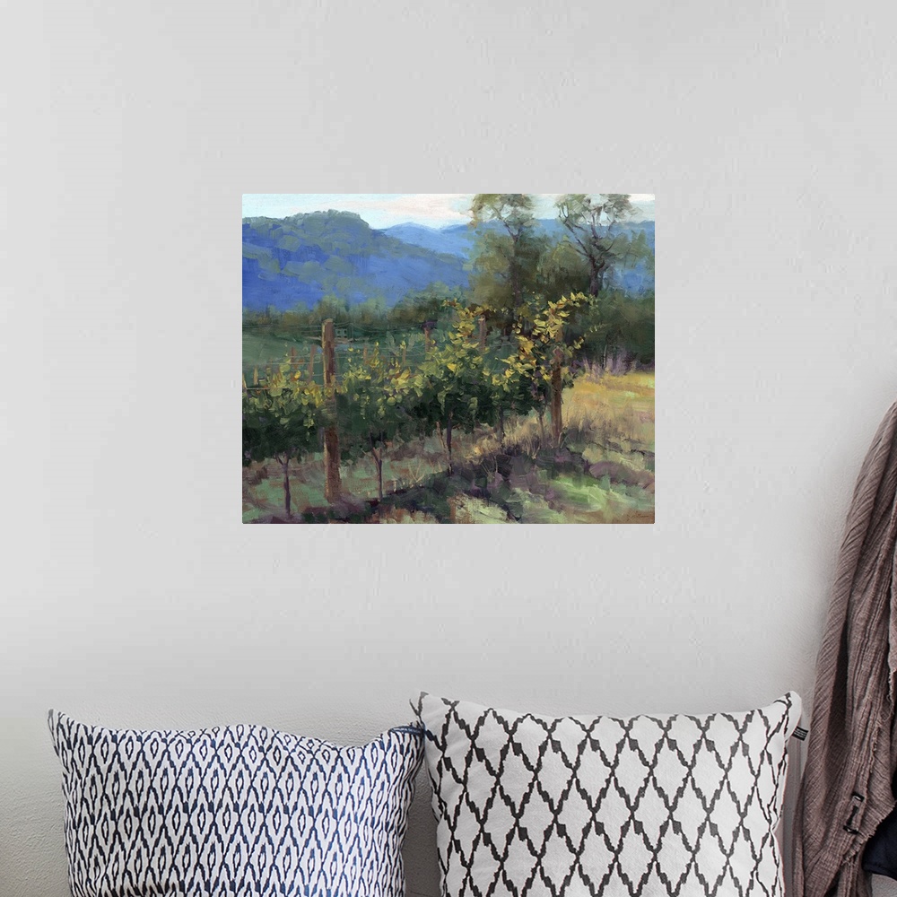 A bohemian room featuring Contemporary painting of plants in a vineyard in a hilly landscape.
