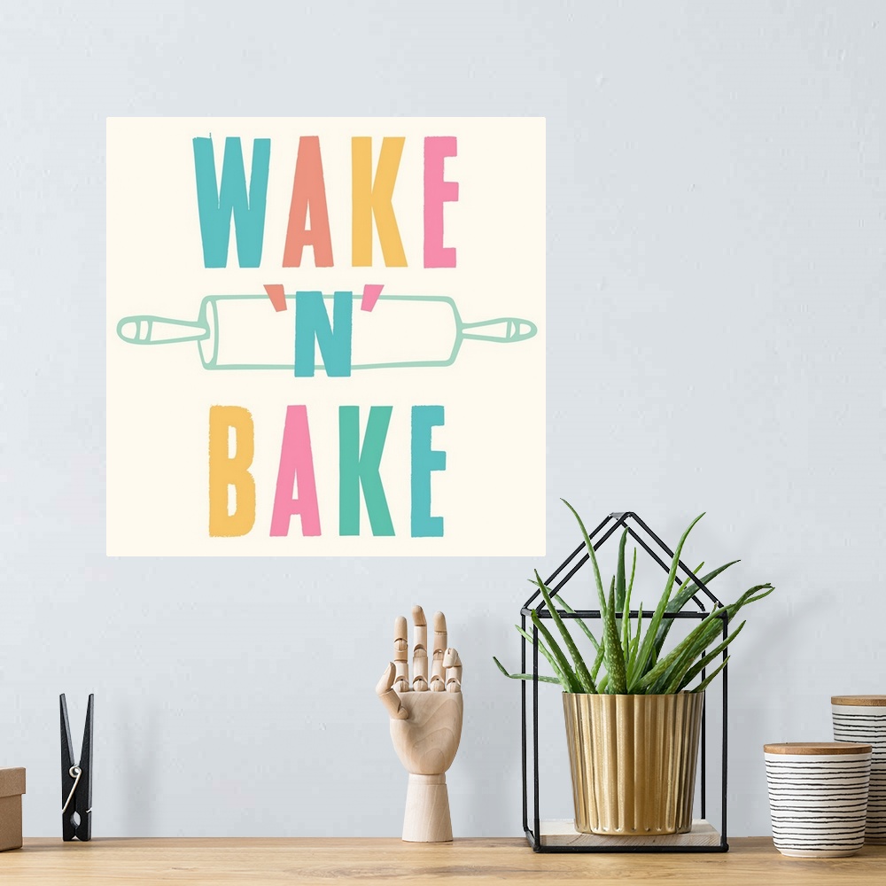 A bohemian room featuring Kitchen art with bold text in rainbow colors and a rolling pin.