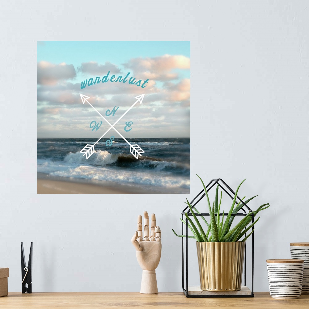 A bohemian room featuring Beach house decor of arrows and typography design against a beach scene.