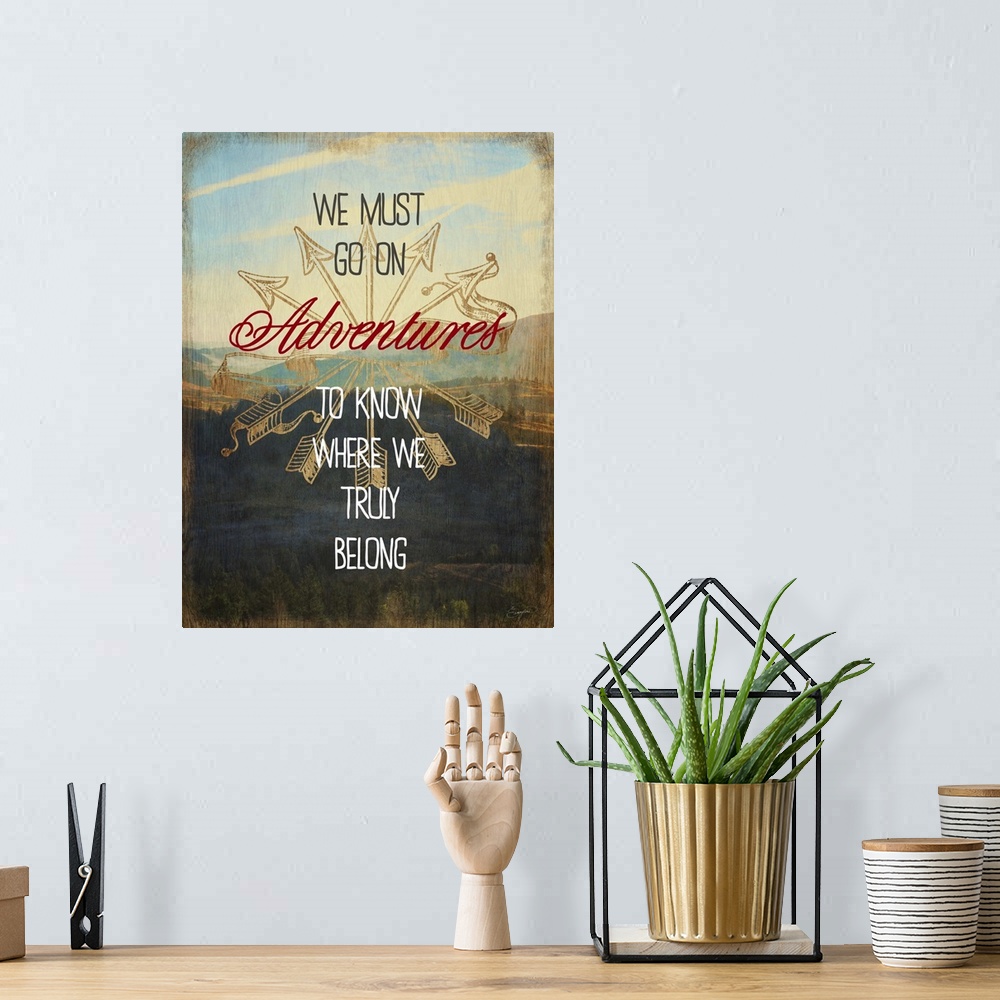 A bohemian room featuring Contemporary artwork with text over a photograph of a mountainous valley.