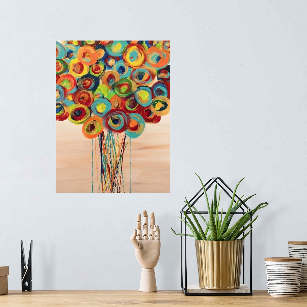 A bohemian room featuring A contemporary abstract painting of a bouquet of colorful flowers in a vase against a light brown...