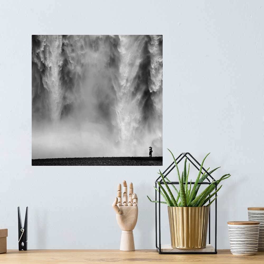 A bohemian room featuring Black and White Photo of waterfall with person