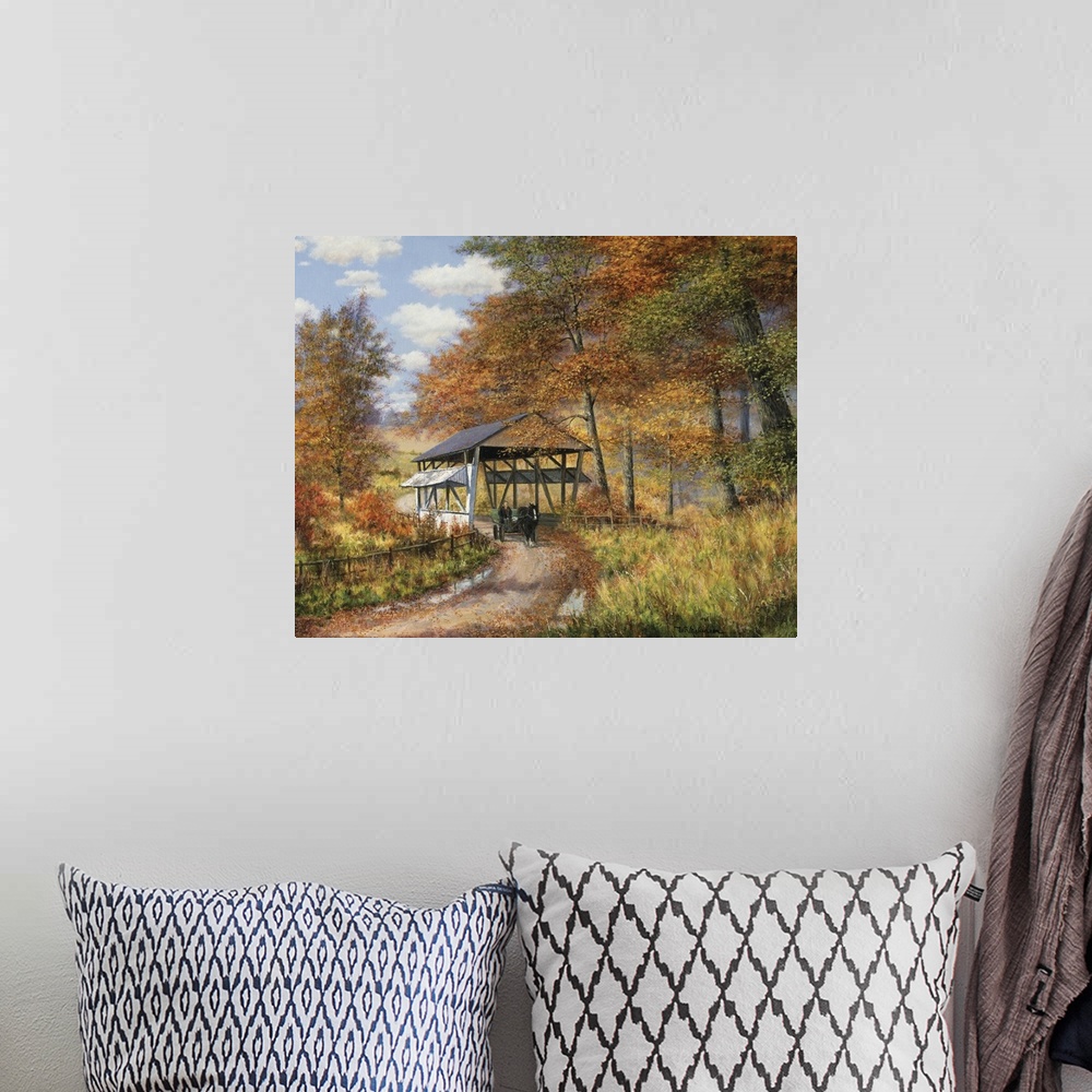 A bohemian room featuring Covered bridge on dirt road through autumn woods.