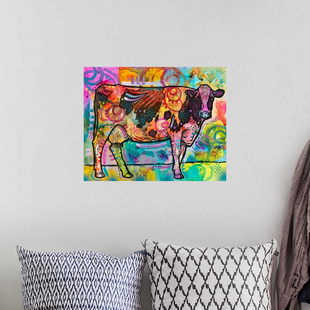 A bohemian room featuring Colorful painting of a cow looking straight at you with abstract designs all over.