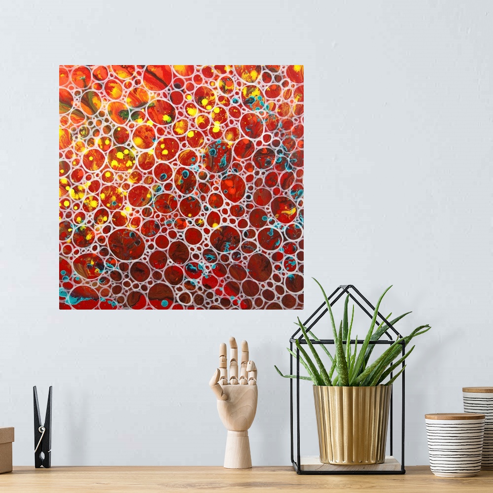 A bohemian room featuring A contemporary abstract painting of a saturated clustering of what resembles air bubbles with vib...