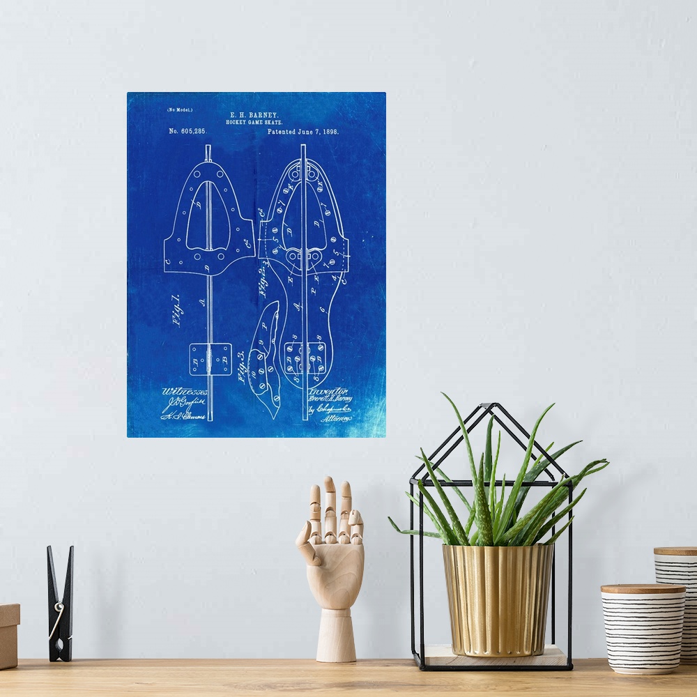 A bohemian room featuring Faded Blueprint 1898 Hockey Skate Patent Poster