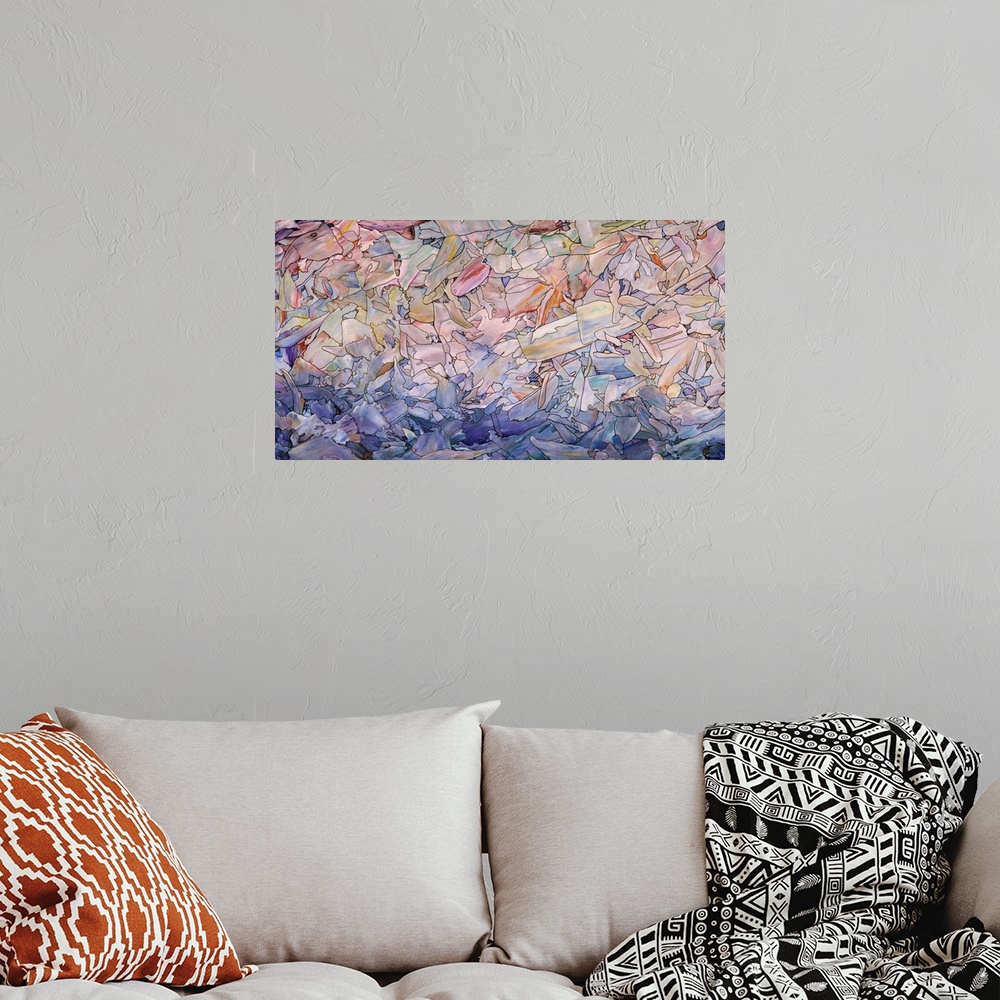 A bohemian room featuring Abstract artwork in the colors of a seascape at dawn.
