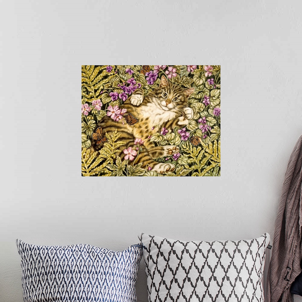 A bohemian room featuring Domestic tiger cat lays on its back in a bed of ferns and flowers batting at butterflies.