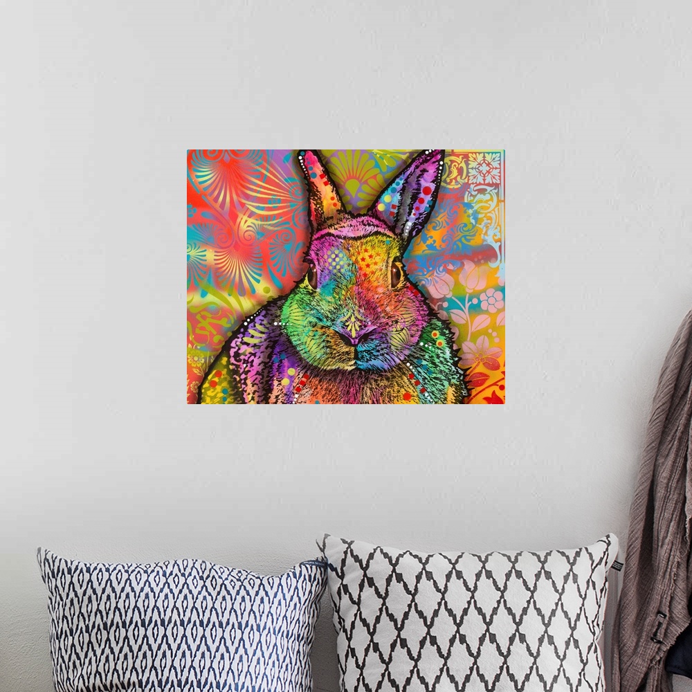 A bohemian room featuring Very colorful painting of a rabbit with abstract and floral designs all over.