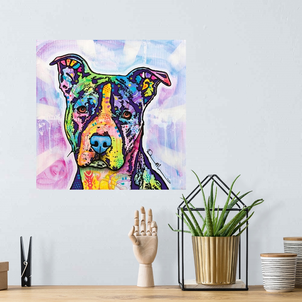 A bohemian room featuring Square art with an illustration of a pit bull with colorful abstract designs all over.