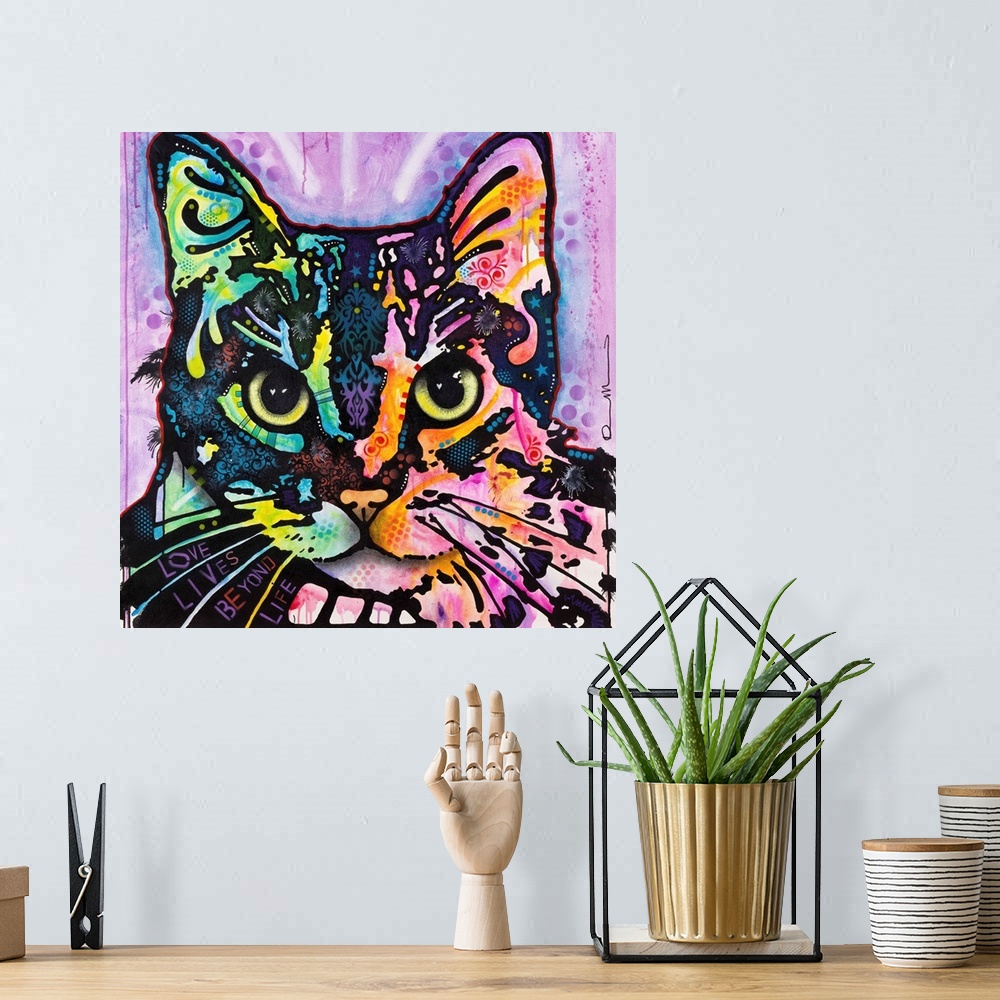 A bohemian room featuring Square art with an illustration of a cat with colorful abstract markings on a purple background.