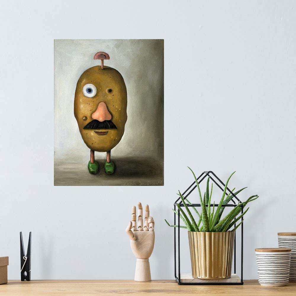 A bohemian room featuring Surrealist painting of a potato head toy with one eye missing and one ear on the top of the head.