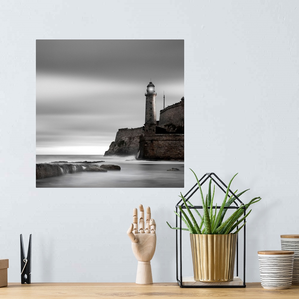 A bohemian room featuring lighthouse, cliff, fortress, ocean, seaside